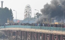 FILE - Iraqi demonstrators take part in the ongoing anti-government protests,in Nassiriya, Iraq, Nov. 28, 2019.