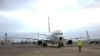 A sailor signals the pilot of a P-8A Poseidon during a preflight check, Oct. 23, 2019, in Oak Harbor, Wash. A Chinese Navy ship fired a laser at a U.S. surveillance aircraft flying over the Philippine Sea west of Guam, the Navy said, Feb. 27, 2020.