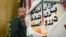 محمد علی جعفری، فرمانده سپاه ایران در همایش "فصلی از مبارزه" در تهران از مقابل پوستری می گذرد که روی آن نوشته "دوران بزن دررو تمام شده است".<br />
عکس : مهدی قاسمی - ایسنا