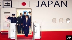 Japanese Prime Minister Yoshihide Suga arrives at Andrews Air Force Base, Md., April 15, 2021. 