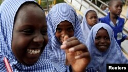 Schoolgirls play outside El-Kanemi Islamic School, where both Western and Islamic curriculums are taught, in Maiduguri.