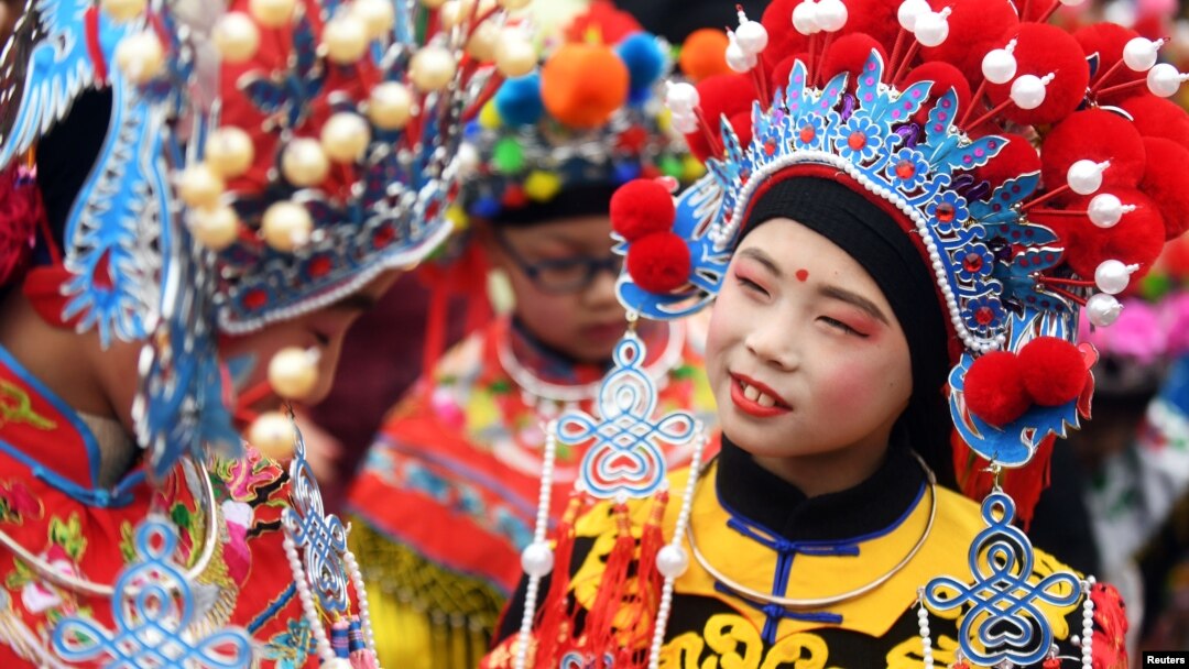 Children wearing costumes wait to perform during an event to celebrate the Chinese Lunar New Year, in Nanjing, Jiangsu province, China February 2, 2019. 