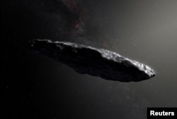 FILE - This artist’s impression shows the first interstellar asteroid, `Oumuamua as it passes through the solar system after its discovery in October 2017. (European Southern Obervatory/M. Kornmesser/Handout via REUTERS/File Photo)