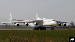 The world's largest airplane, Ukrainian Antonov An-225 Mriya takes off at the airport near Hostomel near Kiev , Ukraine, Tuesday, May 10, 2016. 