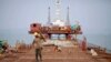 Workers from Indian conglomerate Essar Group construct a new port in Sittwe in Rakhaine state, Burma, May 19, 2012. 