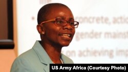 Dr. Monde Muyangwa, a speaker and U.S. representative of the 2015 Gender Mainstreaming Seminar in Arusha, Tanzania speaks with representatives from 16 African nations on May 19. U.S. Army Africa co-hosted the conference, with the Tanzanian Peoples Defense