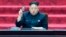 FILE - North Korean leader Kim Jong Un holds up parliament membership certificate during the Supreme People's Assembly in Pyongyang, North Korea.