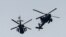 FILE - Israeli military helicopters fly near the Israel-Gaza border, amid the ongoing conflict between Israel and the Palestinian Islamist group Hamas, as seen from southern Israel, December 7, 2023