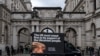 FILE - A digital advertising van, commissioned by Ukrainian campaigners, passes by the Foreign, Commonwealth & Development Office, with a message to urge Britain to stand firm against Russia's attack on Ukraine, in London, Nov. 18, 2024. 