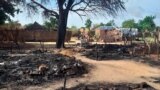 FILE - This photo shows aftermath of an attack in the village of Masteri in west Darfur, Sudan, July 25, 2020. 