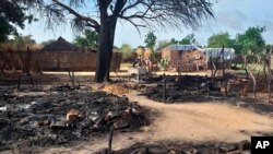 FILE - This photo shows aftermath of an attack in the village of Masteri in west Darfur, Sudan, July 25, 2020. 