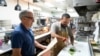 Dan Piacquadio, owner of Harold's Cave Creek Corral, waits to talk with chef and kitchen manager Lucio Osorno, Oct. 3, 2024, in Cave Creek, Ariz.