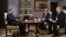 Russian Prime Minister Dmitry Medvedev (L) gives an interview to journalists representing French media ahead of his visit to Paris at the Gorki state residence outside Moscow, November 26, 2012.