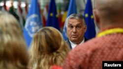 FILE - Hungary's Prime Minister Viktor Orban addresses the media at the European Council Building during EU meetings in Brussels, Belgium, June 24, 2021.