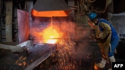 An employee works at a metal production plant in Huangshi in China's central Hubei province, April 1, 2020.