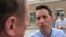 FILE - Republican U.S. Senate candidate Josh Hawley speaks with a man during a campaign rally in suburban St. Louis on Aug. 30, 2018.
