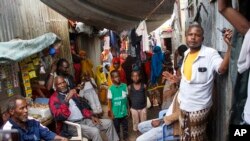 FILE - Residents live in crowded conditions in the Sayidka camp for internally displaced people in Mogadishu, Somalia, March 26, 2020. The country has only a handful of coronavirus cases so far, but camp residents feel vulnerable.