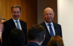 Klaus Schwab, founder and Executive Chairman of the World Economic Forum (WEF), and WEF President Borge Brende arrive for a news conference ahead of the Davos annual meeting in Cologny near Geneva, Switzerland, January 14, 2020. REUTERS/Denis…