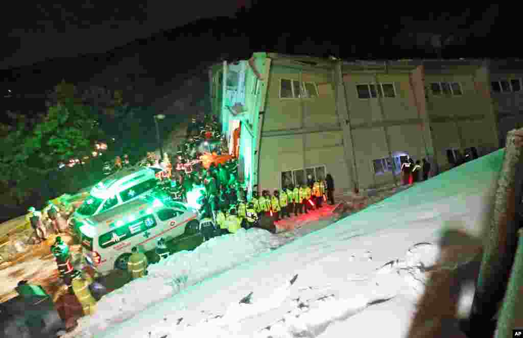 Rescue workers search for survivors from a collapsed resort building in Gyeongju, South Korea, Feb. 17, 2014. 