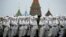 Russian soldiers wear snow gear over Red Army World War II uniforms as they prepare to parade in Red Square in front of St. Basil Cathedral in Moscow, Russia. Thousands of soldiers and military cadets marched across Red Square to mark the 72nd anniversary of a historic World War II parade. The show honored the participants of the Nov. 7, 1941 parade who headed directly to the front lines to defend Moscow from the Nazi forces.
