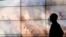 Falco Kuester, a researcher at ALERTCalifornia, a program run by the University of California San Diego, looks at imagery of firefighters at a fire from one of the program's cameras, Sept. 18, 2023, in San Diego. 