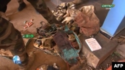 This video grab obtained by AFPTV from Office de Radiodiffusion-Télévision du Mali (ORTM) on September 17, 2024 shows clothes and boots in Bamako.