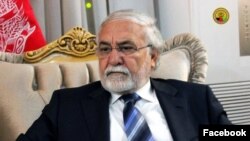 FILE - Sayed Fazlullah Wahidi, former governor of Afghanistan’s western Herat province, arrived in Islamabad, Pakistan with his family to apply for a visa to visit Britain.