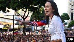 Venezuelan opposition leader Maria Corina Machado addresses supporters during a protest on the eve of the presidential inauguration, in Caracas on Jan. 9, 2025. Aides said security forces "violently intercepted" her convoy later and arrested her.