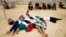 Pro-Palestinian activists stage a die-in in protest near the Paris Tel Aviv Beach event, on the banks of the Seine River, Aug. 13, 2015.