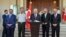 Turkey's Prime Minister Binali Yildirim, center, Chief of Staff Gen. Hulusi Akar, center left, Justice Minister Bekir Bozdag, left, Interior Minister Efkan Ala, second right, and Defense Minister Fikri Isik attend a press conference in Ankara, Turkey, Sat