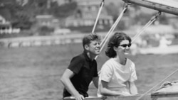 Democratic presidential nominee Sen. John F. Kennedy and wife Jacqueline in cockpit of their sailboat, Victura at Hyannis Port, Mass., Aug. 7, 1960.