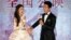 Hong Kong actress Angelababy and Chinese actor Jing Boran laugh during a press conference for the Chinese movie "Love O2O" in Beijing, Aug. 8, 2016.