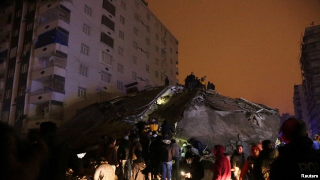 People search through rubble following an earthquake in Diyarbakir, Turkey Feb. 6, 2023.