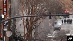  Emergency personnel work at the scene of an explosion in downtown Nashville, Tenn., Dec. 25, 2020. 