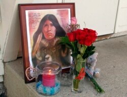 FILE - This Aug. 28, 2017 file photo shows a memorial to Savanna LaFontaine-Greywind outside the apartment where Greywind lived with her parents in Fargo. N.D. Her murder shocked the nation and helped give impetus to the MMIW movement.