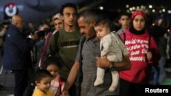 Jordanian citizens and other nationals who were evacuated from Sudan, arrive at Marka Military Airport, in Amman, Jordan April 24, 2023.