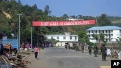 Soldiers of the ethnic Kachin Independence Army (KIA) patrol in downtown Laiza, northeastern Burma, January 4, 2013. 