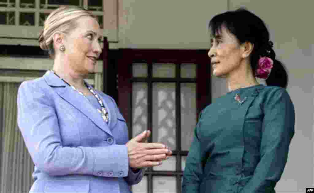 Myanmar's pro-democracy opposition leader Aung San Suu Kyi, right, talks with U.S. Secretary of State Hillary Rodham Clinton after a meeting at Suu Kyi's residence in Yangon, Myanmar, Friday, Dec. 2, 2011. U.S. Secretary of State Clinton and opposition le