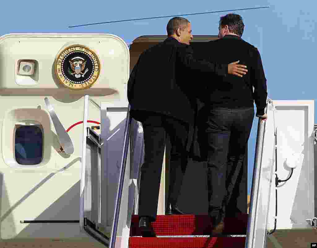 Mr. Obama and Mr. Cameron board Air Force One at Andrews Air Force Base, Maryland, on their way to a basketball game in Ohio on March 13, 2012. (AP)