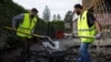 Migrants from the Free Syrian Community of Austria association volunteered to clean up after floods in Kritzendorf, Austria, Sept. 26, 2024.