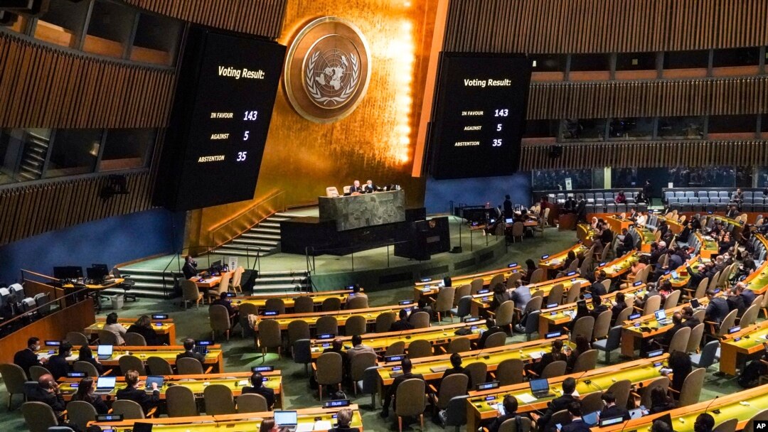 FILE - Video monitors show the result of a United Nations General Assembly special emergency session vote in favor of a resolution condemning Russia's illegal referendum in Ukraine, Oct. 12, 2022.