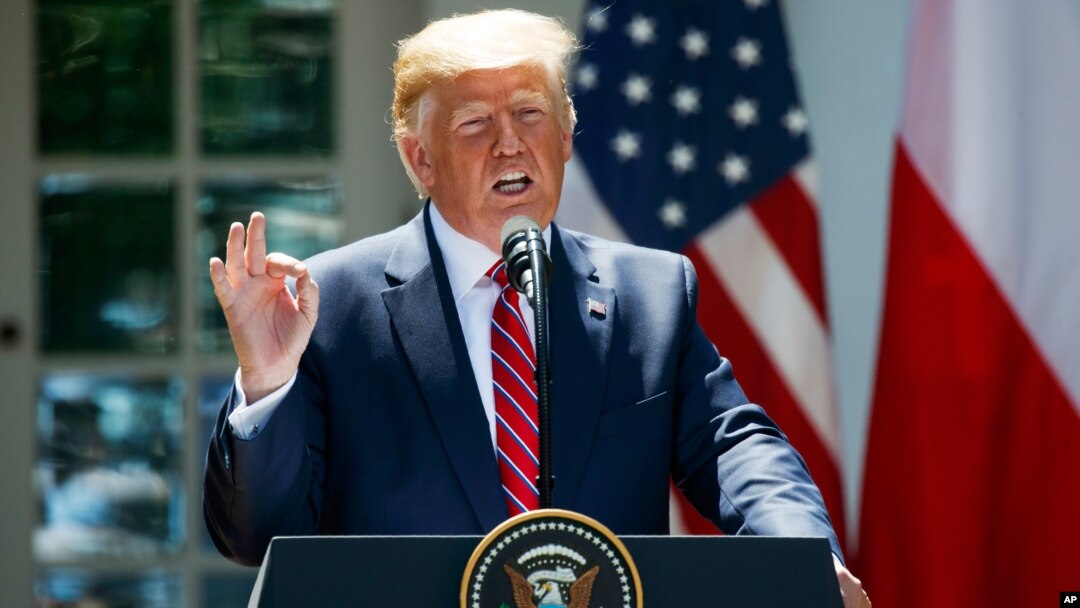 President Donald Trump answers reporter's question during a press conference at the White House in Washington. 