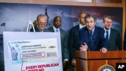 Sen. Sherrod Brown, D-Ohio, joined by Majority Leader Chuck Schumer, D-N.Y., Sen. Raphael Warnock, D-Ga., Sen. Cory Booker, D-N.J., and Sen. Michael Bennet, D-Colo., talk about the child tax credit, at the Capitol in Washington, July 15, 2021.