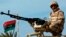 FILE - A member of the Libyan army is seen at the Mellitah Oil and Gas complex, west of Tripoli, March 4, 2013. 