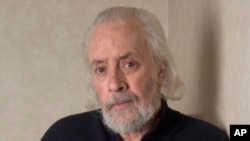 FILE - Screenwriter Robert Towne poses at The Regency Hotel, March 7, 2006, in New York. Towne, the screenplay writer of "Shampoo," "The Last Detail" and other films whose work on "Chinatown" became a model of the art form, died July 1, 2024, 