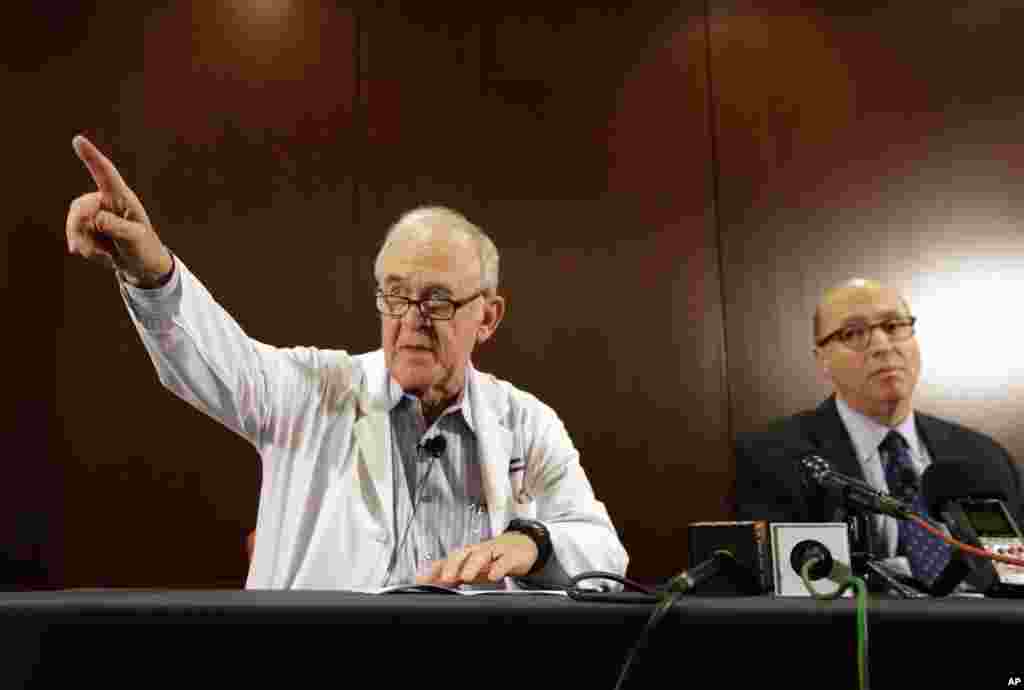 Dr. Edward Goodman (left) epidemiologist at Texas Health Presbyterian Hospital Dallas, takes a&nbsp; question from a reporter as Dr. Mark Lester looks on during a news conference about their patient infected with the Ebola virus. The patient is the first person in the U.S. diagnosed with Ebola,&nbsp;in Dallas, Texas, Sept. 30, 2014. 
