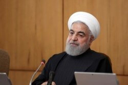 In this photo released by the official website of the Office of the Iranian Presidency, President Hassan Rouhani speaks during a Cabinet meeting in Tehran, Jan. 15, 2020.