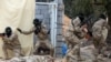 Libyan security forces trained by the Turkish military demonstrate their skills during a graduation ceremony in Khums, Libya April 8, 2021. (Hazem Ahmed/Reuters)