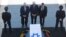 Former US President Bill Clinton, center, accompanied by Israel's President Reuven Rivlin, left, and Yuli Edelstein, the Speaker of the Knesset, pays respects by the coffin of former Israeli President Shimon Peres at the Knesset plaza in Jerusalem, Sept. 