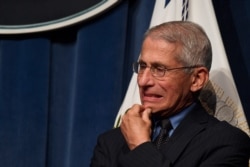 Dr. Anthony Fauci, director of the National Institute of Allergy and Infectious Diseases, listens during a news conference with members of the Coronavirus Task Force at the Department of Health and Human Services in Washington, June 26, 2020.
